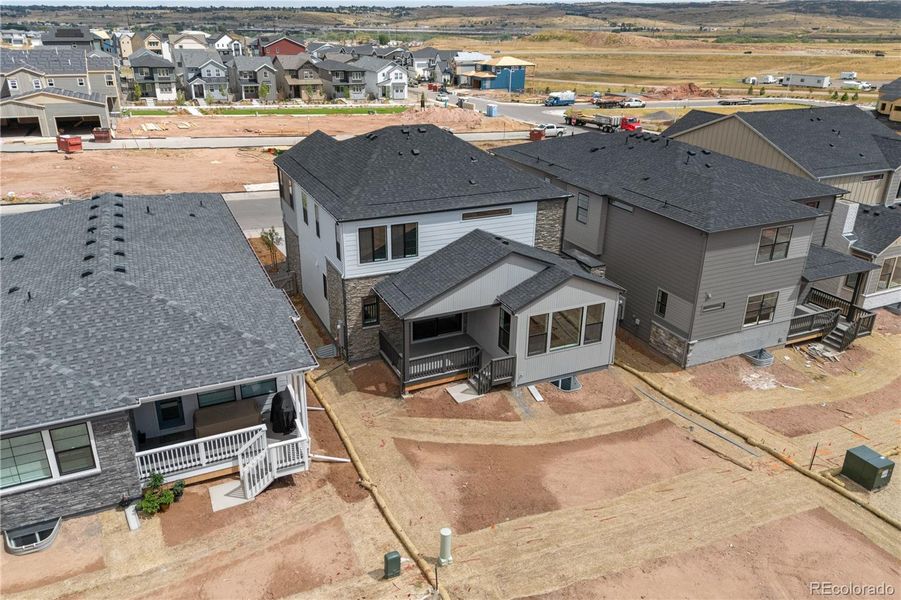 Front exterior of a new home in Harmony at Sterling Ranch, Littleton, CO, highlighting curb appeal (Image 23). Front exterior of a new home in Harmony at Sterling Ranch, Littleton, CO, highlighting curb appeal (Image 23).