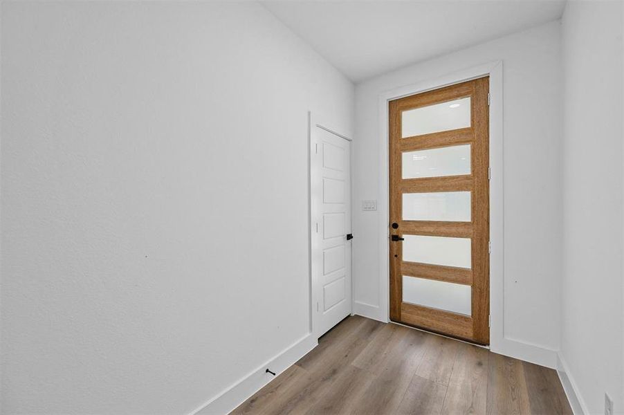 Foyer featuring light wood-type flooring