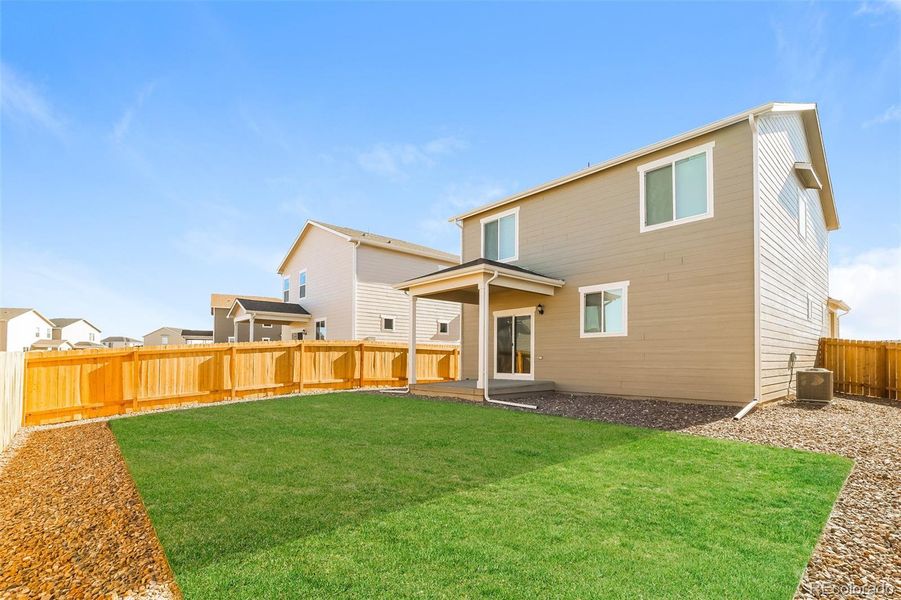Exterior details and patio area of a home in Second Creek Farm, Commerce City (Image 13).