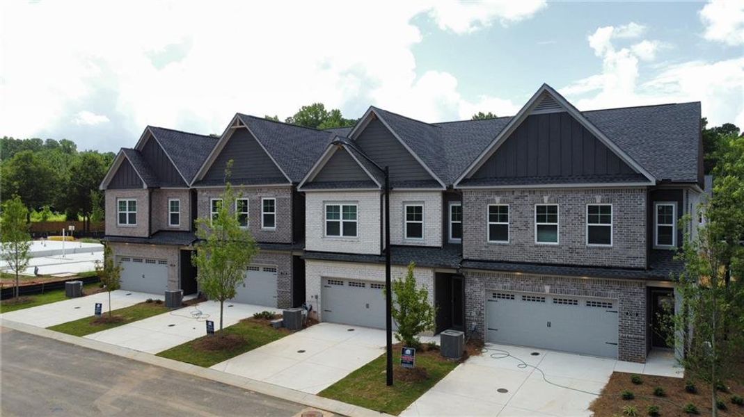 Front exterior of a new home in Governors Parc, Kennesaw, GA, highlighting curb appeal (Image 21). Front exterior of a new home in Governors Parc, Kennesaw, GA, highlighting curb appeal (Image 21).