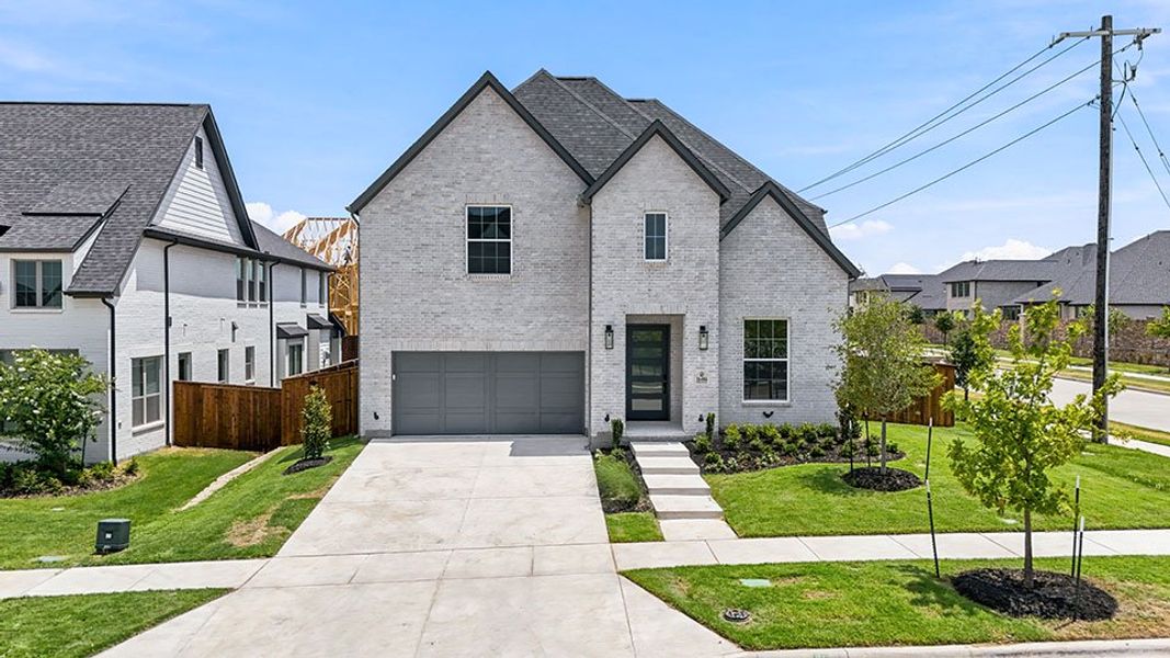 Front exterior of a new home in Estates at Rockhill, Frisco, TX, highlighting curb appeal (Image 26).