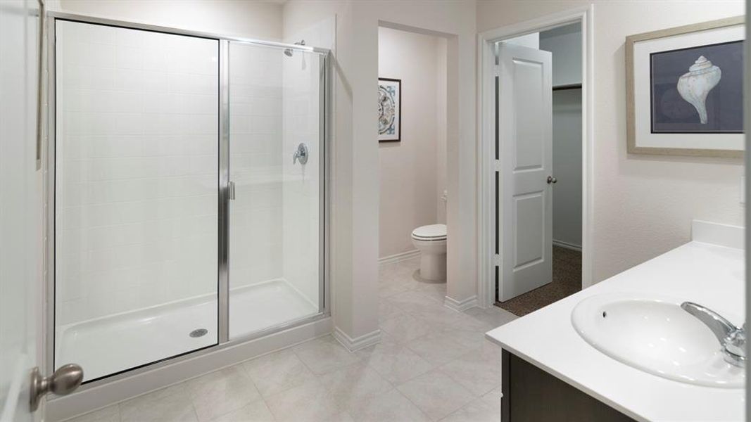 Bathroom with vanity and a stall shower