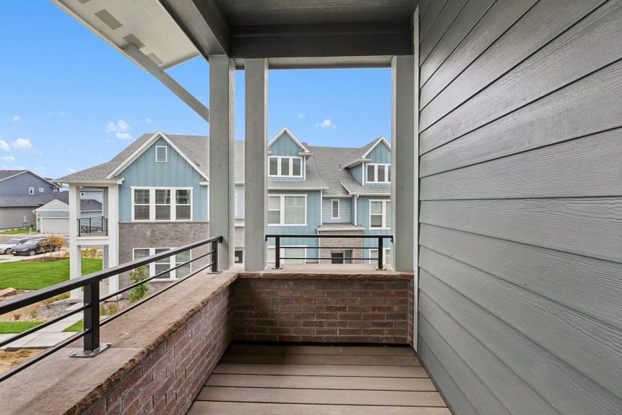 Exterior details and patio area of a home in Kinston Mainstreet Townhomes, Loveland (Image 3). Exterior details and patio area of a home in Kinston Mainstreet Townhomes, Loveland (Image 3).