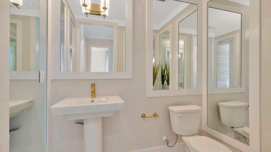 The Half Bathroom of another Grand Sabal Model which is available at Serengeti.