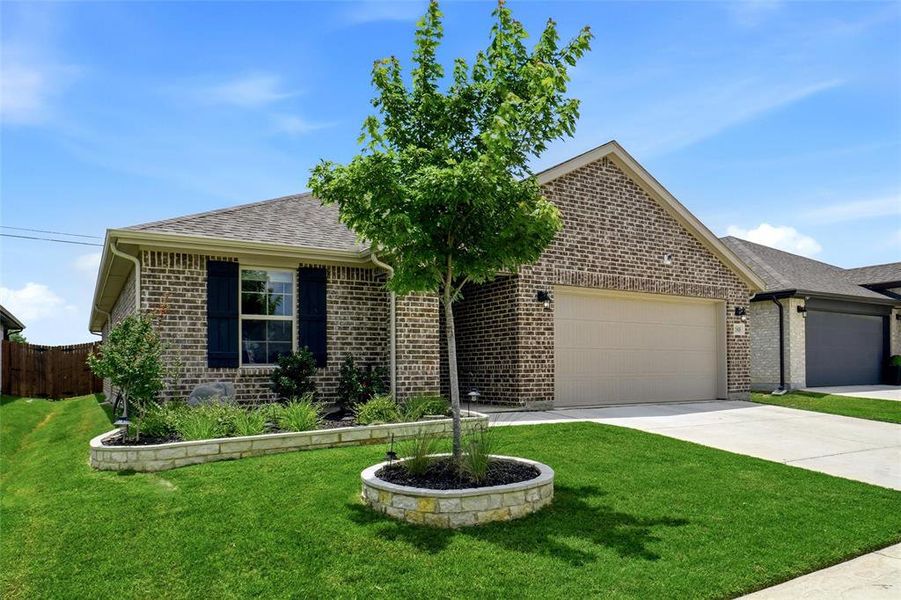 Front exterior of a new home in Stark Farms, Denton, TX, highlighting curb appeal (Image 2). Front exterior of a new home in Stark Farms, Denton, TX, highlighting curb appeal (Image 2).
