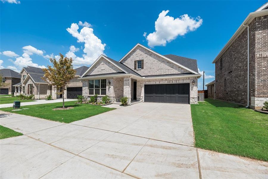 Front exterior of a new home in Arbors at Legacy Hills, Celina, TX, highlighting curb appeal (Image 2). Front exterior of a new home in Arbors at Legacy Hills, Celina, TX, highlighting curb appeal (Image 2).