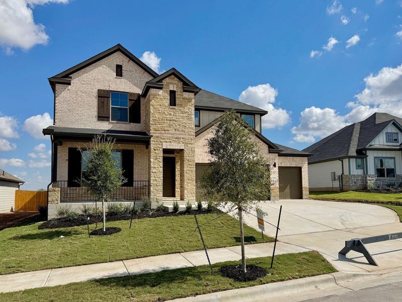 Front exterior of a new home in Prairie Winds, Hutto, TX, highlighting curb appeal (Image 21).