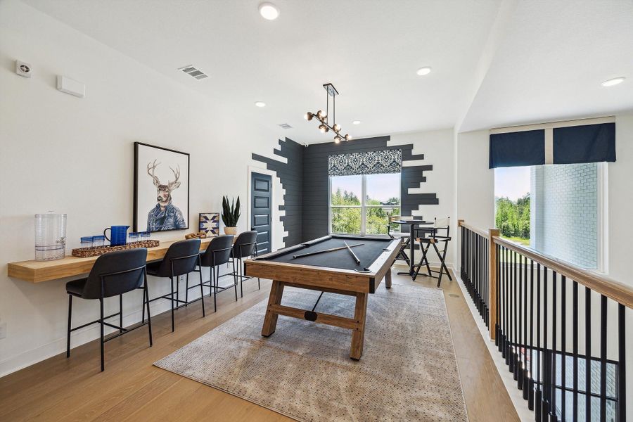 Representative furnished interior of a home built from the The Jaxson IX by Westin Homes in The Woodlands Hills, Willis (Image 24).