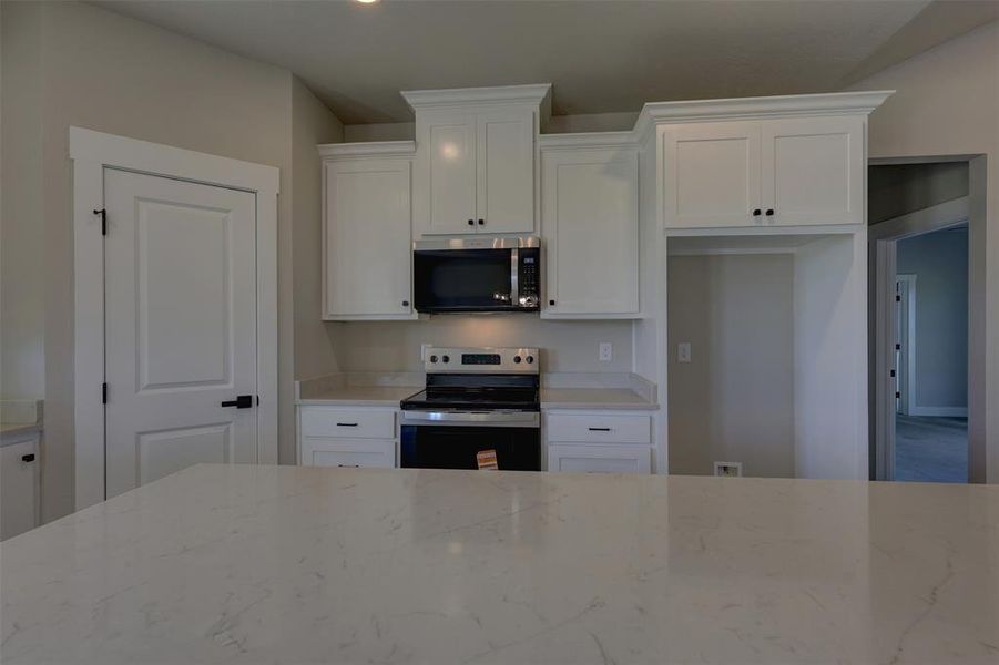 Furnished interior view inside a new home in , Whitney (Image 8).