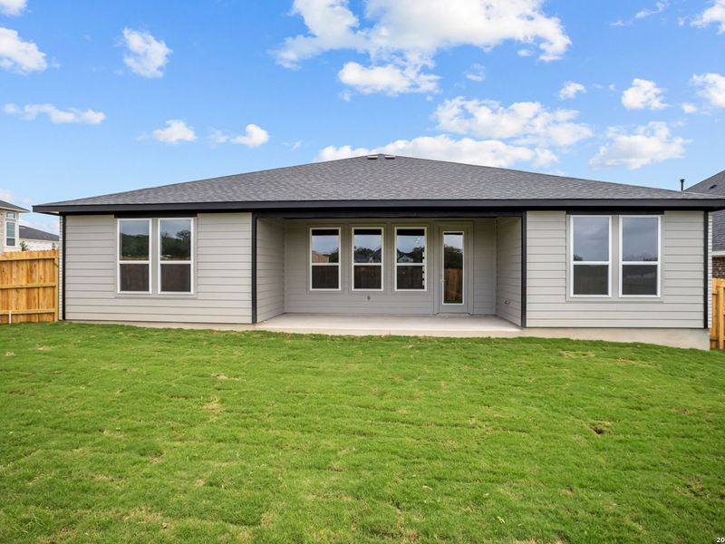 Exterior details and patio area of a home in The Reserve at Potranco Oaks, Castroville (Image 4).