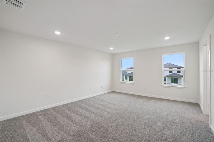 Spacious, unfurnished interior of a new home in Grasslands West, Lakeland (Image 18).
