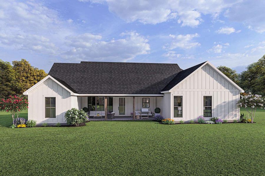 Back of house with roof with shingles, a patio, board and batten siding, and a yard