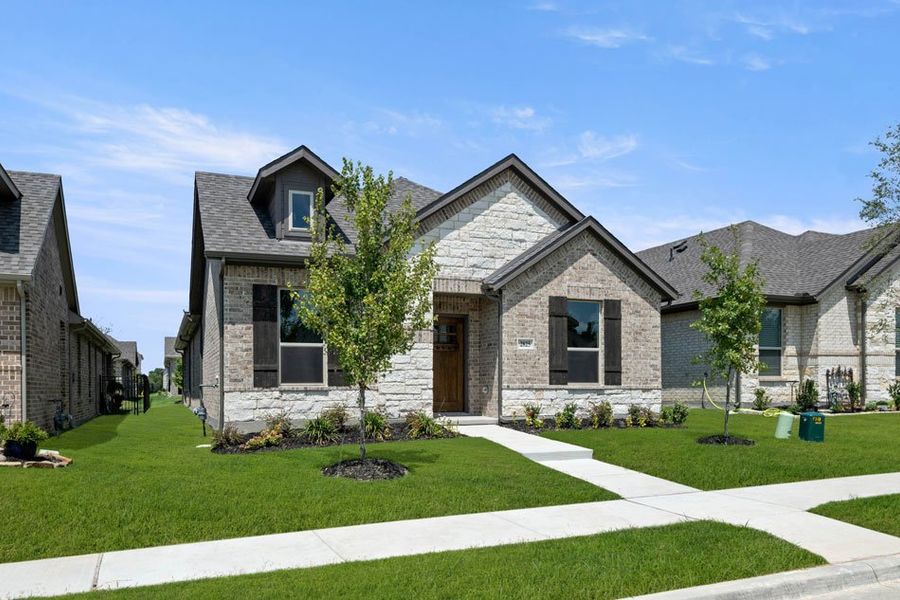 Front exterior of a new home in Redden Farms – Active Adult, Midlothian, TX, highlighting curb appeal (Image 28). Front exterior of a new home in Redden Farms – Active Adult, Midlothian, TX, highlighting curb appeal (Image 28).