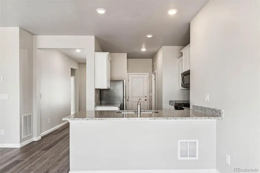 Furnished interior view inside a new home in Second Creek Farm, Commerce City (Image 3).