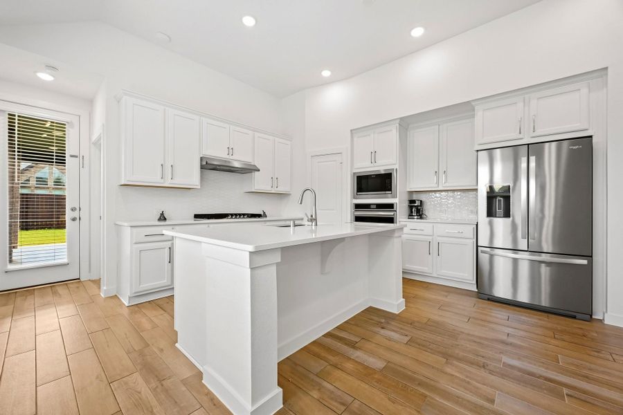 Furnished interior view inside a new home in Meridiana, Iowa Colony (Image 5).