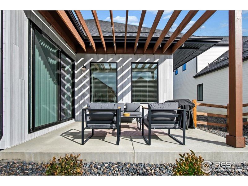 Exterior details and patio area of a home in Pelican Shores at Water Valley, Windsor (Image 25).