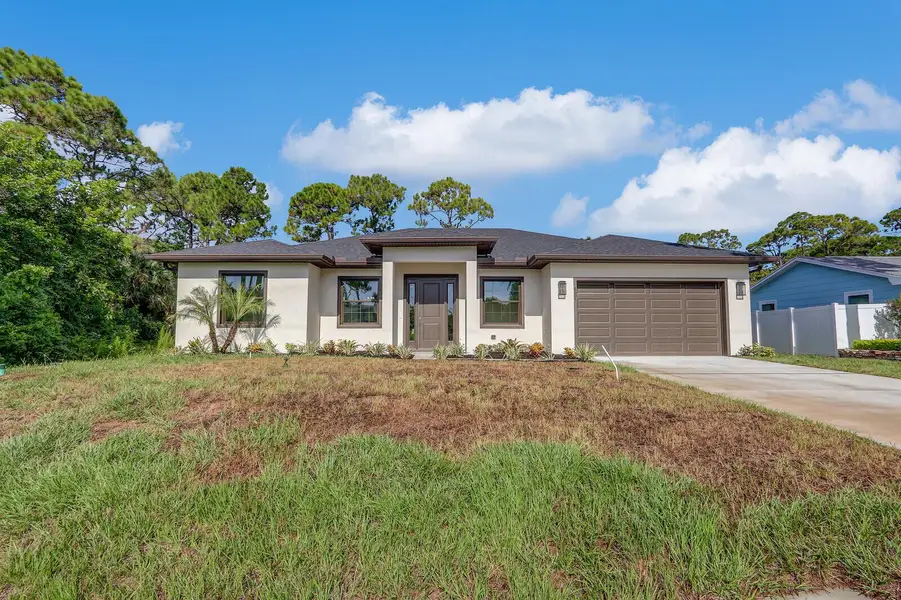 Front exterior of a new home in , Fort Pierce, FL, highlighting curb appeal (Image 1). Front exterior of a new home in , Fort Pierce, FL, highlighting curb appeal (Image 1).