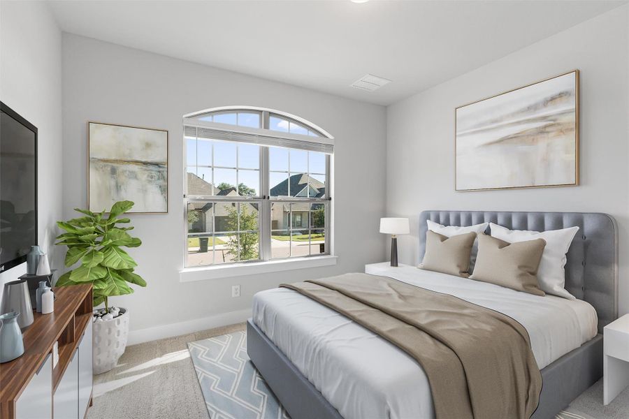 Carpeted bedroom with baseboards