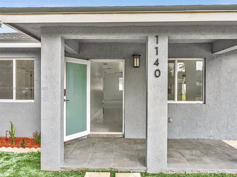 Front exterior of a new home in , North Miami, FL, highlighting curb appeal (Image 23). Front exterior of a new home in , North Miami, FL, highlighting curb appeal (Image 23).