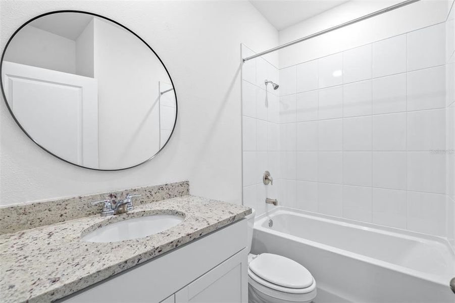 Furnished interior view inside a new home in The Grove at Stuart Crossing - Premier Series, Bartow (Image 11).