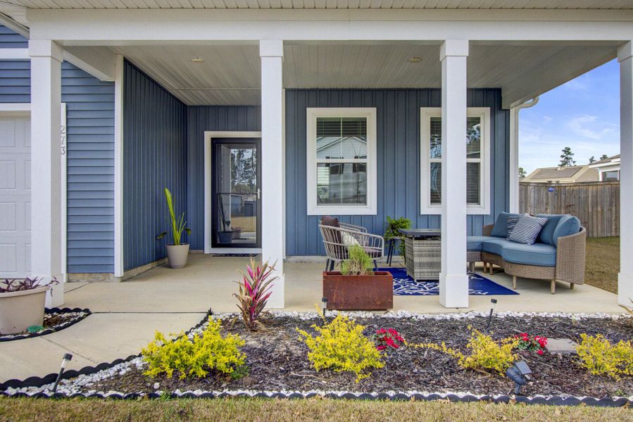 Exterior details and patio area of a home in Sanctuary Cove at Cane Bay, Summerville (Image 3).