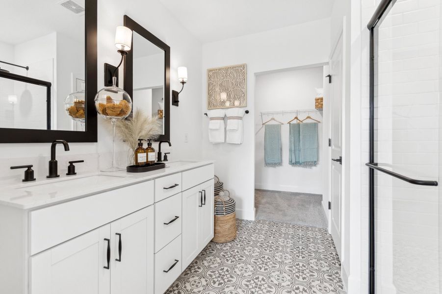 Primary bath with white freestanding vanity