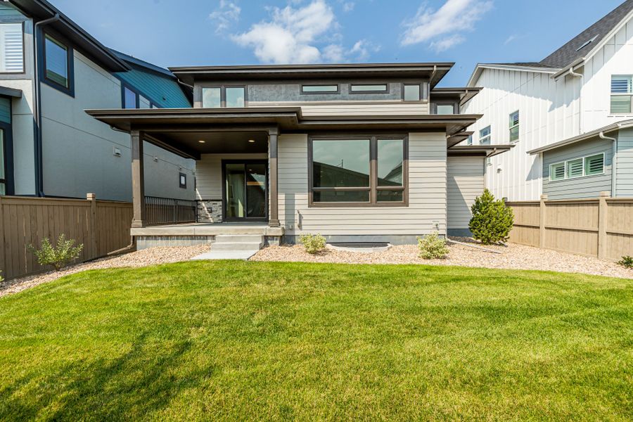 Front exterior of a new home in West Grange, Longmont, CO, highlighting curb appeal (Image 27).