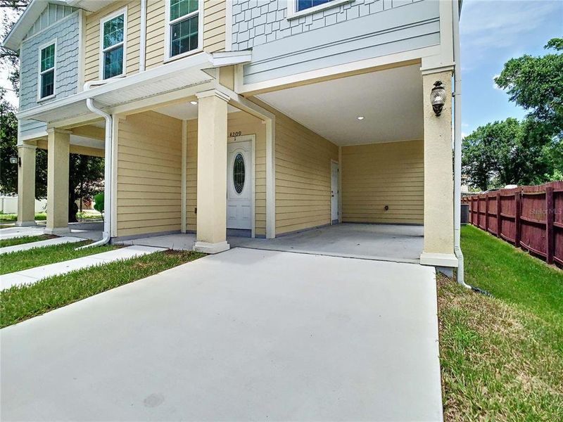 Front exterior of a new home in , Tampa, FL, highlighting curb appeal (Image 1).