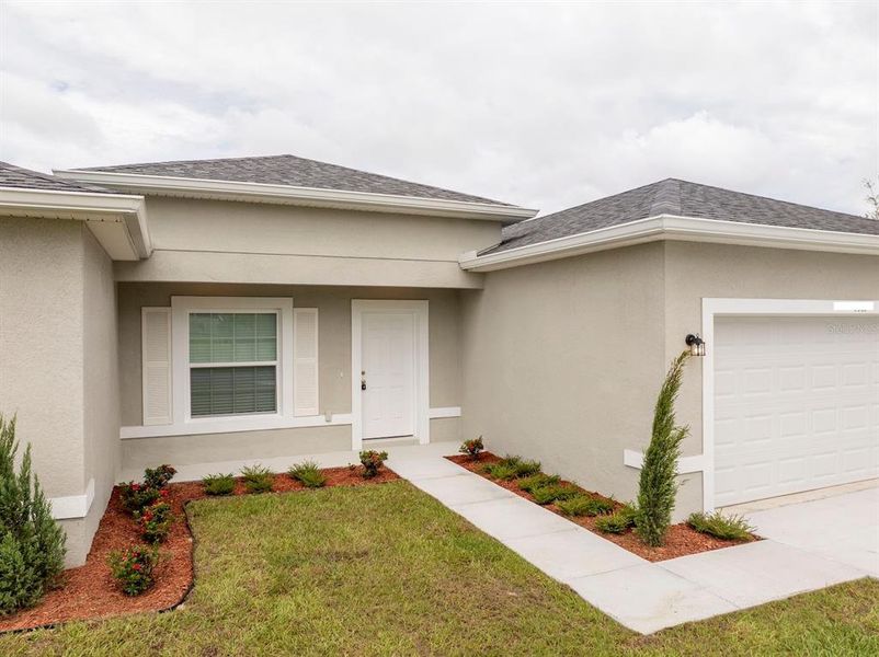 Front exterior of a new home in , Ocala, FL, highlighting curb appeal (Image 31).