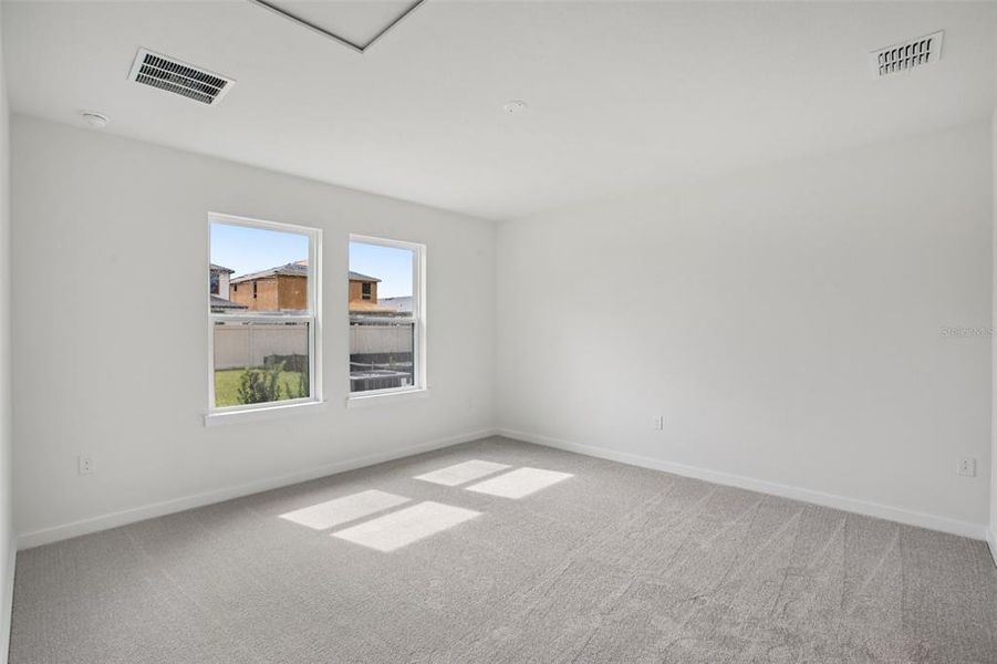 Spacious, unfurnished interior of a new home in Grasslands West, Lakeland (Image 31).