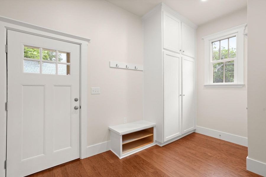 A convenient mudroom entryway provides ample storage and a clear view to the outdoors. A convenient mudroom entryway provides ample storage and a clear view to the outdoors.