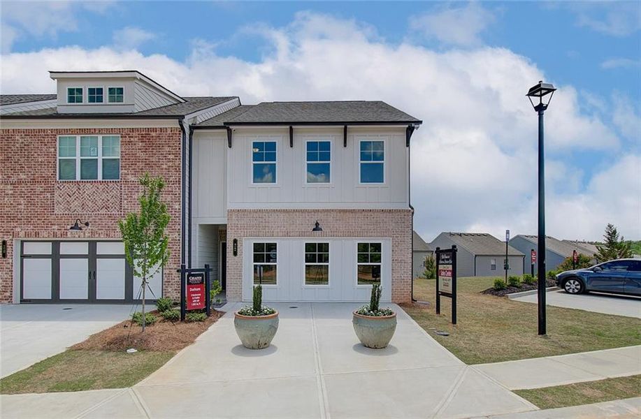Front exterior of a new home in The Towns at Auburn Station West, Auburn, GA, highlighting curb appeal (Image 24).