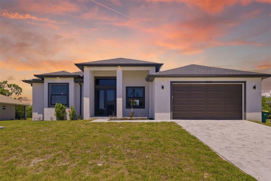 Front exterior of a new home in , Port Charlotte, FL, highlighting curb appeal (Image 25).