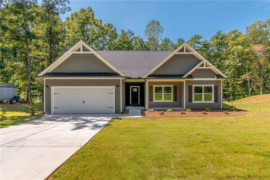 Front exterior of a new home in , Murrayville, GA, highlighting curb appeal (Image 1).