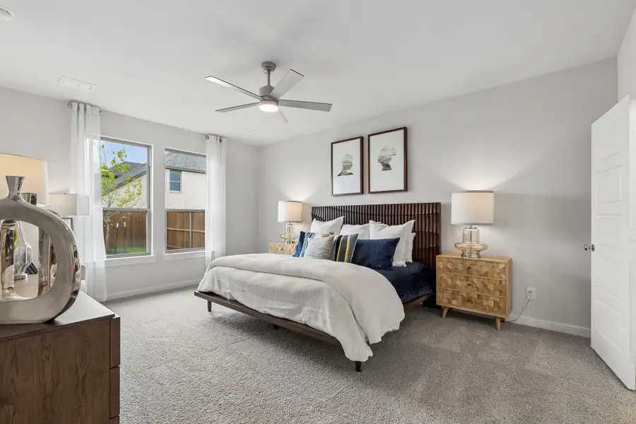 Primary Suite in a Madero Winters Model Home in Haslet TX by Trophy Signature Homes