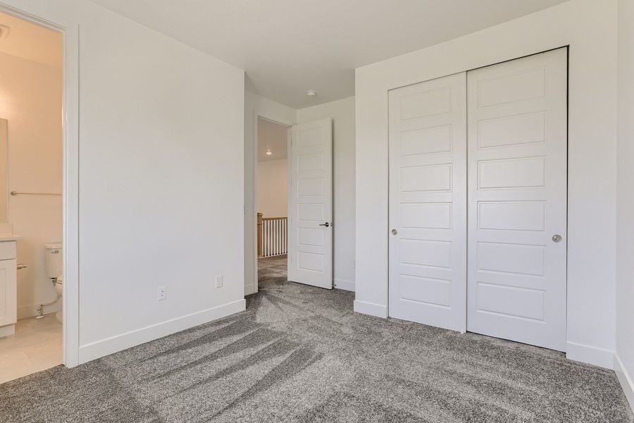 Upstairs secondary bedroom in Cornell II plan at The Outlook at Southshore by Century Communities