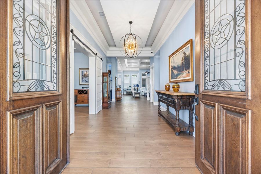 A grand entry welcomes you into refined interiors showcasing soaring ceilings, designer lighting, and sophisticated finishes curated for luxurious everyday living.