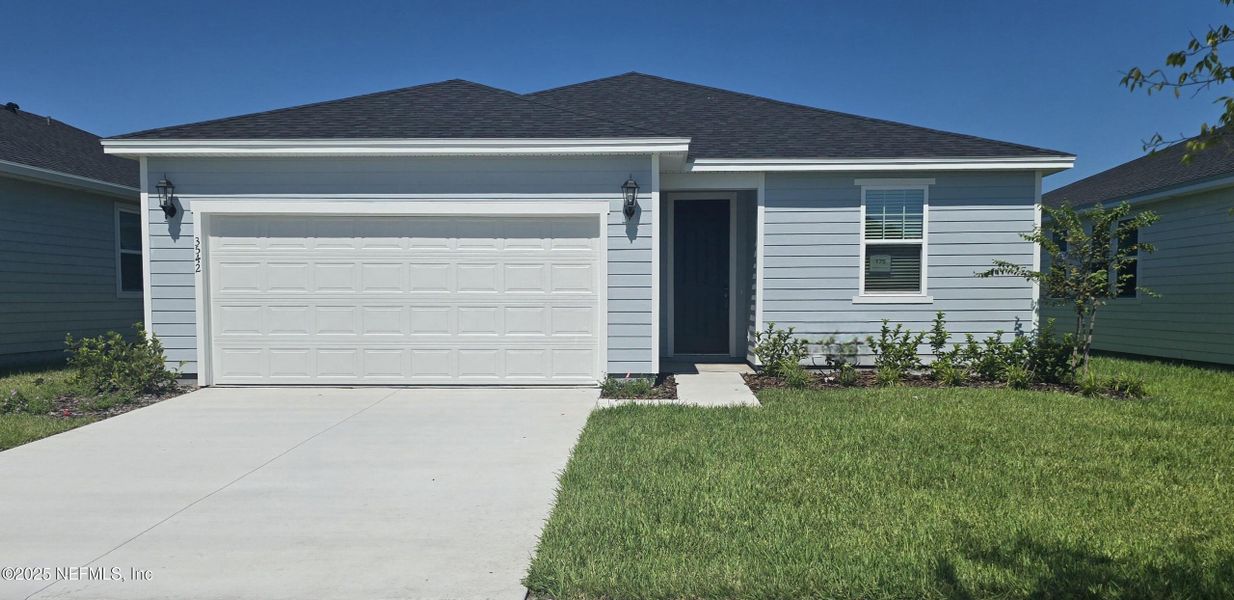 Front exterior of a new home in Lakes at Bella Lago - Signature Series, Green Cove Springs, FL, highlighting curb appeal (Image 15). Front exterior of a new home in Lakes at Bella Lago - Signature Series, Green Cove Springs, FL, highlighting curb appeal (Image 15).