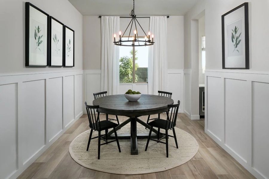 Dining room with passthrough to butler's pantry option. Finishes and options may vary by community