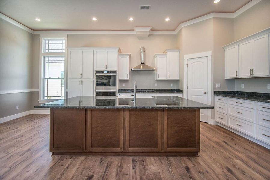 Representative furnished interior of a home built from the Beaumont Elite by Enchanted Homes in Pointe Summit, Slater-Marietta (Image 13).