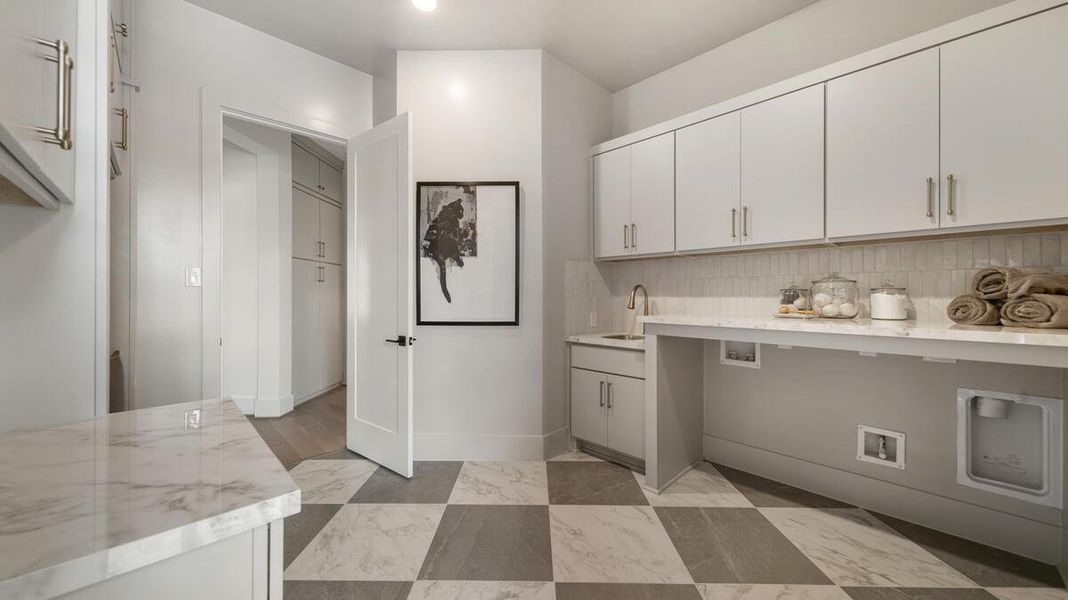 The oversized utility room maximizes functionality. Representative image. The oversized utility room maximizes functionality. Representative image.