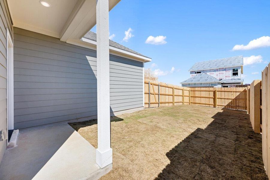 Exterior details and patio area of a home in Lariat, Liberty Hill (Image 27).