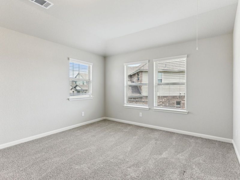 Guest bedroom in the Matador floorplan at a Meritage Homes community.