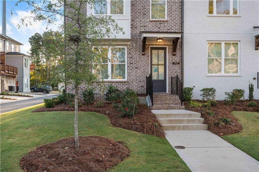 Exterior details and patio area of a home in Brackley Townhomes, Cumming (Image 25). Exterior details and patio area of a home in Brackley Townhomes, Cumming (Image 25).