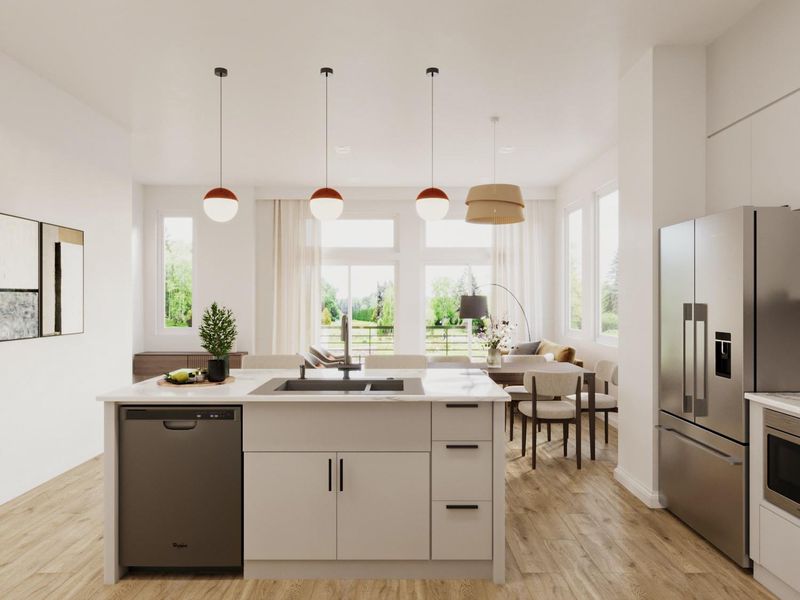 Kitchen with light countertops, a wealth of natural light, a center island with sink, and stainless steel appliances