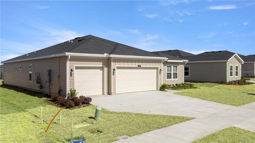 Front exterior of a new home in Pioneer Ranch, Ocala, FL, highlighting curb appeal (Image 4).
