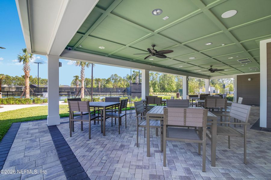 Exterior details and patio area of a home in Edenbrooke at Hyland Trail | 55+, Green Cove Springs (Image 14).