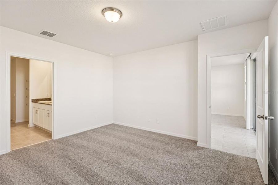 Spacious, unfurnished interior of a new home in The Reserve at Hammock Oaks - Classic Series, Lady Lake (Image 11).