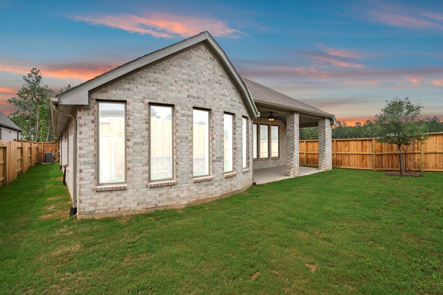 Exterior details and patio area of a home in Wildtree, Magnolia (Image 24).
