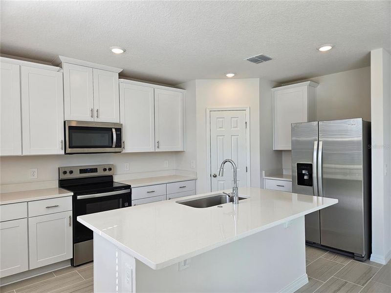 Furnished interior view inside a new home in Lawson Dunes - Signature Series, Haines City (Image 17).